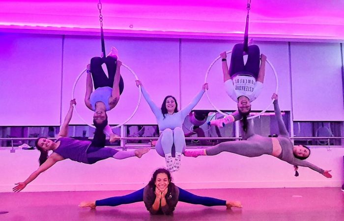 women on hoops at a Aerial Fitness class